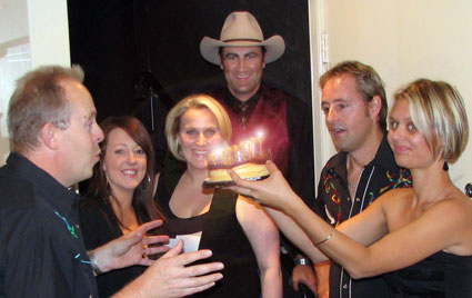 BOB HOWE blows out the candles, watched by Liz & Rae (THE HARMONATORS), PETER PRATT, STUIE FRENCH & CAMILLE TE NAHU!
